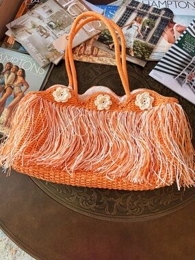 Vacation/Beach bag.
Orange Fringe Crochet Tote Bag with Floral Accents.